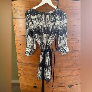 Long sleeve light lined dress or long shirt over leggings/tights.